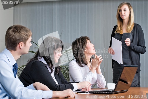 Image of Pretty woman making a business presentation