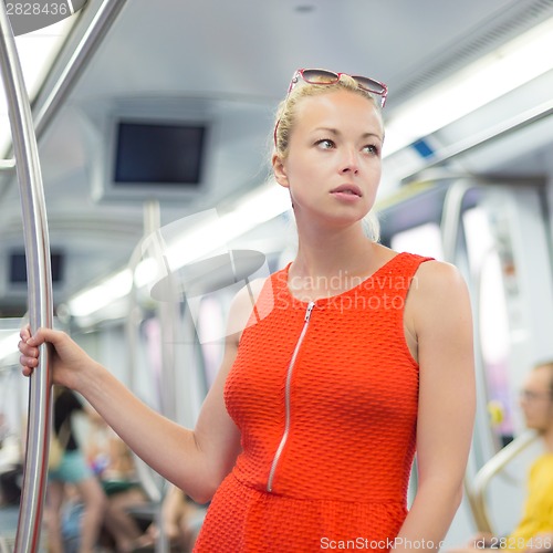 Image of Lady traveling by metro.