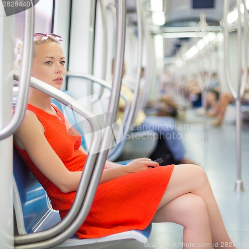 Image of Lady traveling by metro.