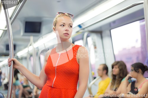 Image of Lady traveling by metro.