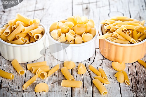 Image of uncooked pasta in three bowls 