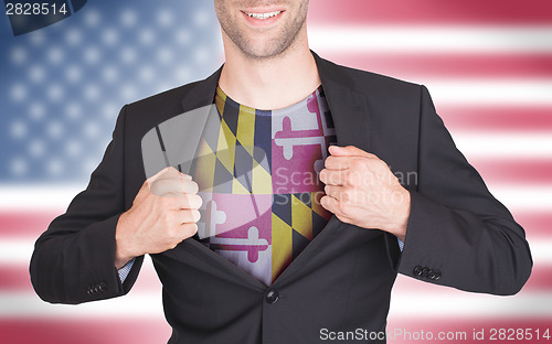 Image of Businessman opening suit to reveal shirt with state flag