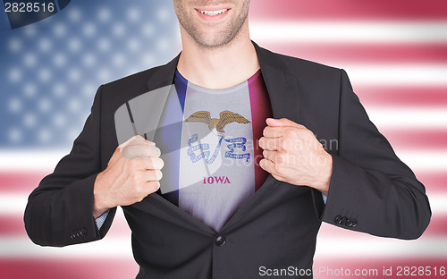 Image of Businessman opening suit to reveal shirt with state flag