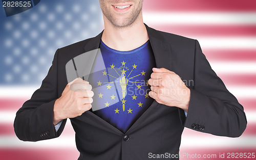 Image of Businessman opening suit to reveal shirt with state flag