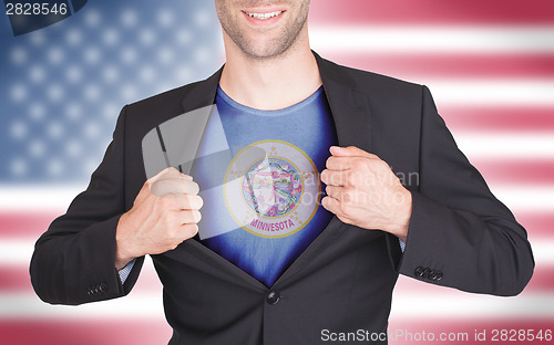 Image of Businessman opening suit to reveal shirt with state flag