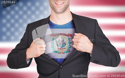 Image of Businessman opening suit to reveal shirt with state flag