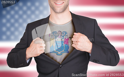 Image of Businessman opening suit to reveal shirt with state flag