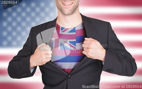 Image of Businessman opening suit to reveal shirt with state flag