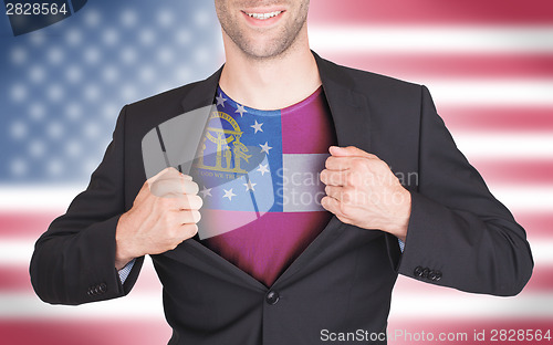 Image of Businessman opening suit to reveal shirt with state flag