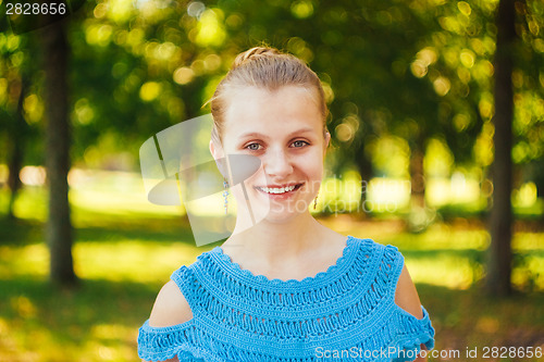 Image of Closeup Portrait Of Girl In Blue Knitted Dress