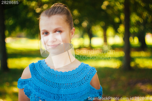 Image of Closeup Portrait Of Girl In Blue Knitted Dress