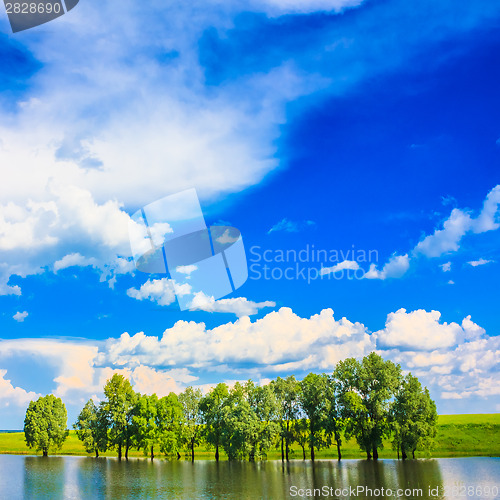 Image of Calm River. Clouds Reflection On Lake