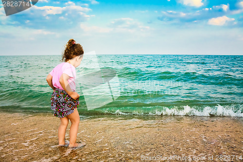 Image of Child Running On Water At Ocean Beach.