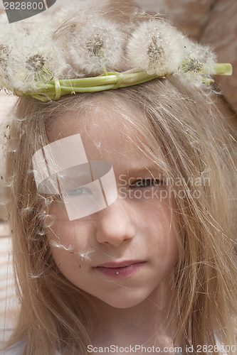 Image of little girl in white dandelion garland