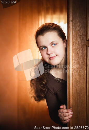 Image of Girl Opening Door