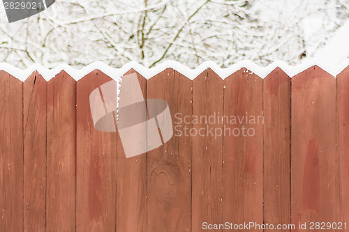 Image of Old Wooden Fence In A Snow