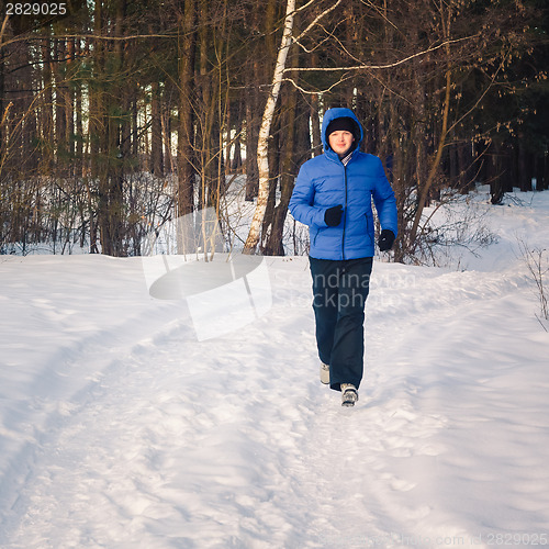 Image of Handsome Man In Winter Forest