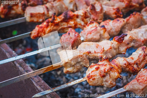 Image of Shish Kebab In Process Of Cooking On Open Fire Outdoors