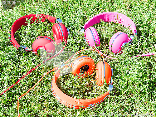 Image of Set of three varicolored colorful headphones 