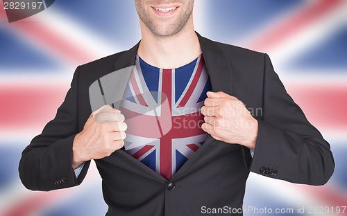 Image of Businessman opening suit to reveal shirt with flag