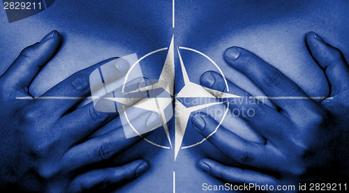 Image of Hands covering breasts