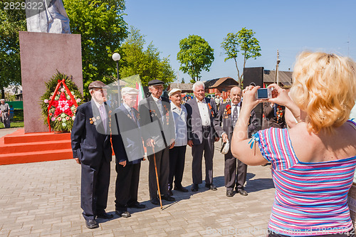 Image of Unidentified veterans posing at camera during the celebration of