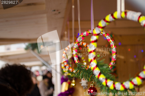 Image of ring rotating shiny strip with red toy at showcase 