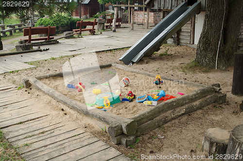 Image of sandbox full toy on children park in summer time 