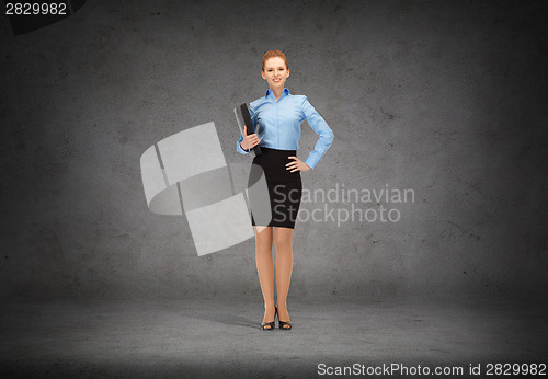 Image of smiling businesswoman with folder