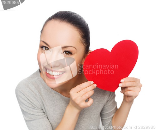 Image of smiling asian woman with red heart