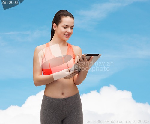 Image of sporty woman with tablet pc computer