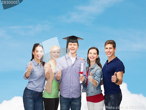 Image of group of students with diploma showing thumbs up