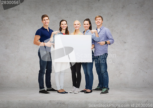 Image of group of smiling students with white blank board