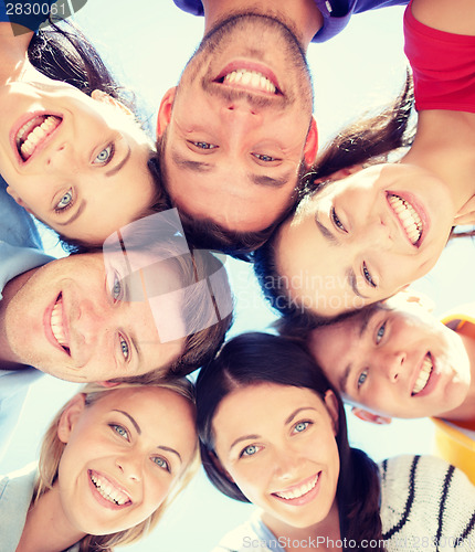 Image of group of teenagers looking down