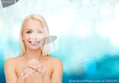 Image of face and hands of beautiful woman