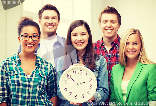 Image of group of students at school with clock