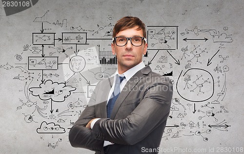 Image of attractive businessman or teacher in glasses