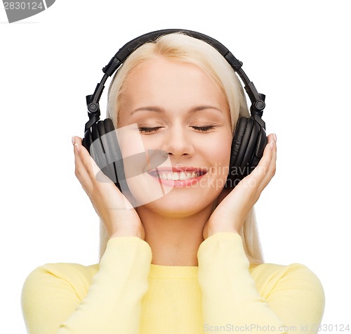 Image of smiling young woman with headphones