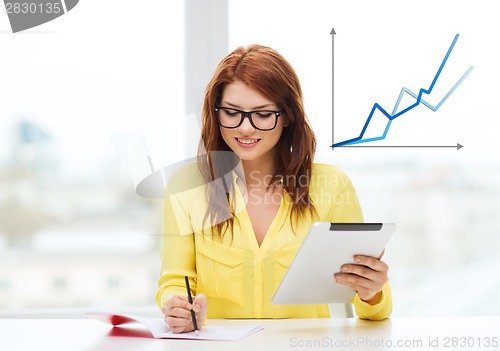 Image of student with tablet pc computer and notebook