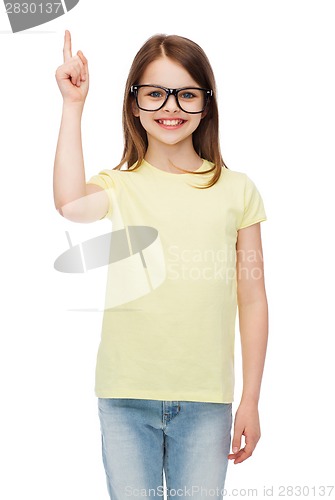 Image of smiling cute little girl in black eyeglasses