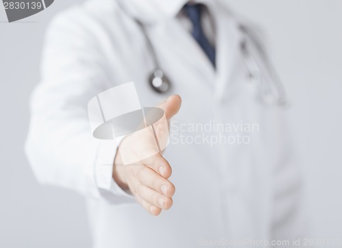 Image of male doctor with open hand ready for hugging