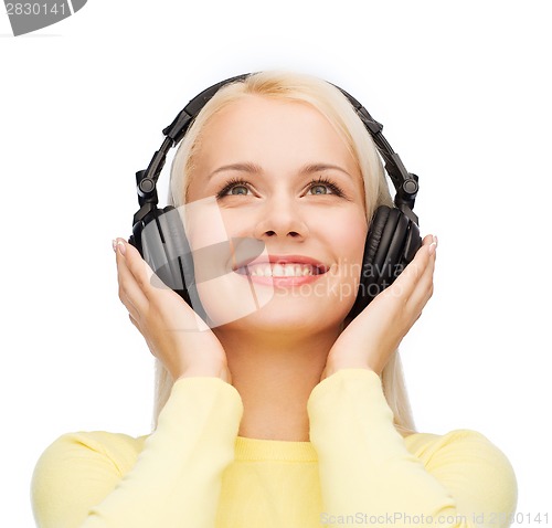 Image of smiling young woman with headphones