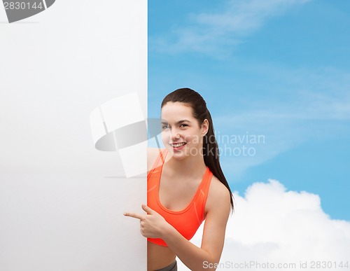 Image of teenage girl in sportswear with white board