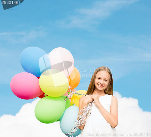 Image of happy girl with colorful balloons