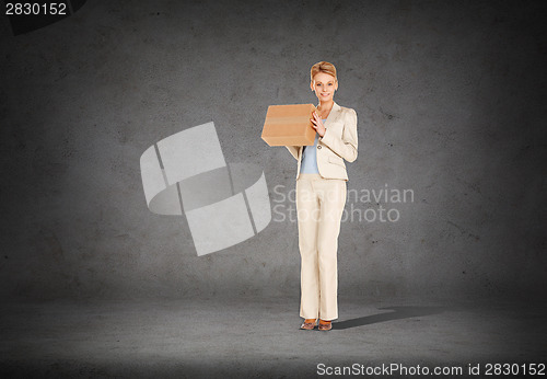 Image of businesswoman delivering cardboard box