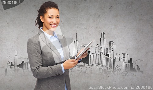 Image of smiling woman looking at tablet pc