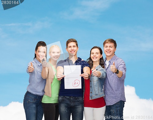 Image of group of students showing test and thumbs up