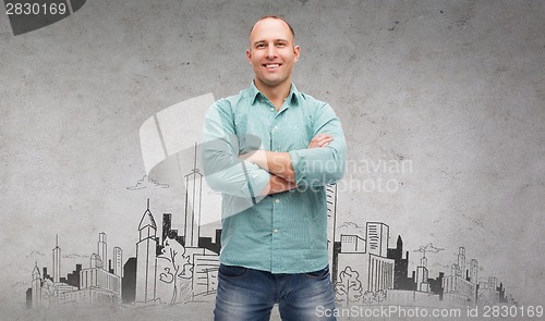 Image of smiling man with crossed arms