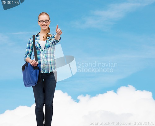 Image of student with laptop bag showing thumbs up