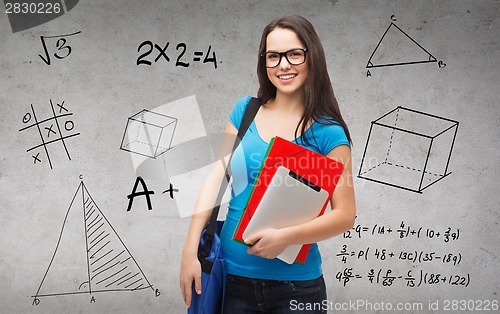 Image of smiling student with bag, folders and tablet pc